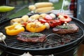 Barbecue grill with meat and vegetables, closeup Royalty Free Stock Photo