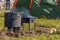 A barbecue grill with a barbecue shish kebab is ready for cooking on a hike