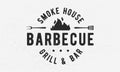 Barbecue Grill - vintage logo concept. Logo of Barbecue, Grill, Smoke House with fire flame, grill fork and spatula. BBQ logo, pos Royalty Free Stock Photo