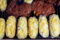 Barbecue grilled beef meat and prepared potatoes Royalty Free Stock Photo