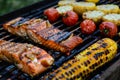 Barbecue grilled salmon fillets and corn cobs, outdoor summer meal Royalty Free Stock Photo