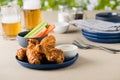 Barbecue hot chicken wings with beers at pub garden Royalty Free Stock Photo