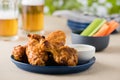 Barbecue hot chicken wings with beers at pub garden Royalty Free Stock Photo