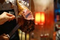 Barbecue leg of lamb on skewer - Churrasco Brazilian BBQ cooked on the rotisserie served by cutting meat directly off skewers