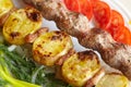 Barbecue Lula Kebab with minced meat, fresh vegetables and greens Royalty Free Stock Photo