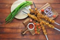 Barbecue meat. Chicken kebab. Chicken Shashlik with vegetables on wooden background. Royalty Free Stock Photo