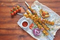 Barbecue meat. Chicken kebab. Chicken Shashlik with vegetables on wooden background. Royalty Free Stock Photo