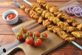 Barbecue meat. Chicken kebab. Chicken Shashlik with vegetables on wooden background. Royalty Free Stock Photo