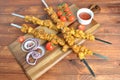 Barbecue meat. Chicken kebab. Chicken Shashlik with vegetables on wooden background. Royalty Free Stock Photo