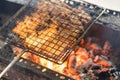 Barbecue meat cooking on fire - the ingredient of bun cha the famous Vietnamese noodle soup with bbq meat, spring roll, vermicelli Royalty Free Stock Photo