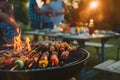 Barbecue party with people in the background, grilled steak, grilled meat and vegetables, summer party, barbecue in the garden, Royalty Free Stock Photo