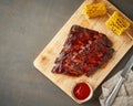 Barbecue pork ribs. Slow cooking recipe. Brown background Royalty Free Stock Photo