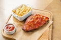 Barbecue pork spare rib. Grilled pork baby ribs with spicy bbq sauce served with french fries. Royalty Free Stock Photo