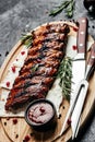 Barbecue Pork Spare Ribs with BBQ sauce on board, vertical image. top view. place for text Royalty Free Stock Photo