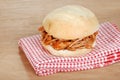 Barbecue pulled pork sandwich on red and white nap Royalty Free Stock Photo