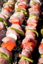 Barbecue with raw meat skewers Royalty Free Stock Photo