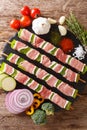 For barbecue raw shish kebab with pepper and lard on skewers close-up and ingredients, vegetables, spices, herbs. Vertical top vi Royalty Free Stock Photo