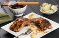 Barbecue Rib Snack with Cipollini Onions and Potato Salad Royalty Free Stock Photo