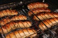 Barbecue with roasting sausages on the grill Royalty Free Stock Photo