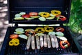 Barbecue set on the grill. grilled sausages, vegetables on the grill. picnic Royalty Free Stock Photo