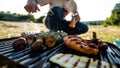 Barbecue set of vegetables and meat with a man with bear in the background Royalty Free Stock Photo