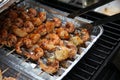 Barbecue shrimps on grill with grippers Royalty Free Stock Photo