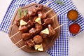 Barbecue skewers with juicy meat on wooden board Royalty Free Stock Photo