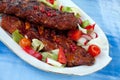 Barbecue spare ribs from a grill with vegetables Royalty Free Stock Photo