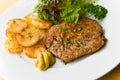 Barbecue with steaks of pork,fried potatoes,salad Royalty Free Stock Photo