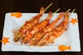 Barbecue tiger shrimps with salted fish sauce, chilli, rum wine. Asian food Royalty Free Stock Photo