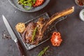 Barbecue Tomahawk Steak on grill roast with herb prepared for grill