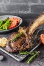 Barbecue Tomahawk Steak on grill roast with herb prepared for grill