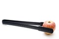 Barbecue tongs with red apple