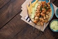 Barbecued chicken breast skewers with flatbread and avocado sauce Royalty Free Stock Photo