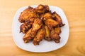 Barbecued Chicken Wings on Square White Plate Royalty Free Stock Photo