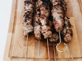 Barbecued lean cubed pork kebabs close up