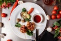 Barbecued marinated turkey or chicken meat shish kebab skewers with ketchup sauce and grilled vegetables on rustic wooden table Royalty Free Stock Photo