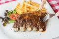 Barbecued Pork Ribs with french fries Royalty Free Stock Photo