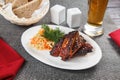 Pork ribs and barbeque sauce with parsley and bread Royalty Free Stock Photo