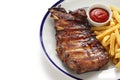 Barbecued pork spare ribs and french fries Royalty Free Stock Photo
