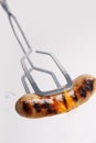 Barbecued sausage and flames Royalty Free Stock Photo