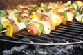 Barbecuing skewers on grill