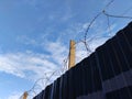 Barbed twisted wire metal fence close view photo