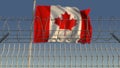 Barbed wire against waving flag of Canada. 3D rendering Royalty Free Stock Photo