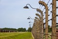 Barbed wire around the Auschwitz-Birkenau concentration camp. Oswiecim, Poland, 16 May 2022 Royalty Free Stock Photo