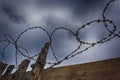 Barbed wire on the background of clouds over Royalty Free Stock Photo