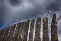 Barbed wire on the background of clouds over Royalty Free Stock Photo