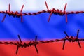 Barbed wire on background of flag of Russia. Sanctions against Russia