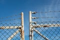 Barbed-wire and chain-link fence Royalty Free Stock Photo