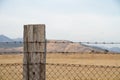 Barbed wire entanglement with wooden post Royalty Free Stock Photo